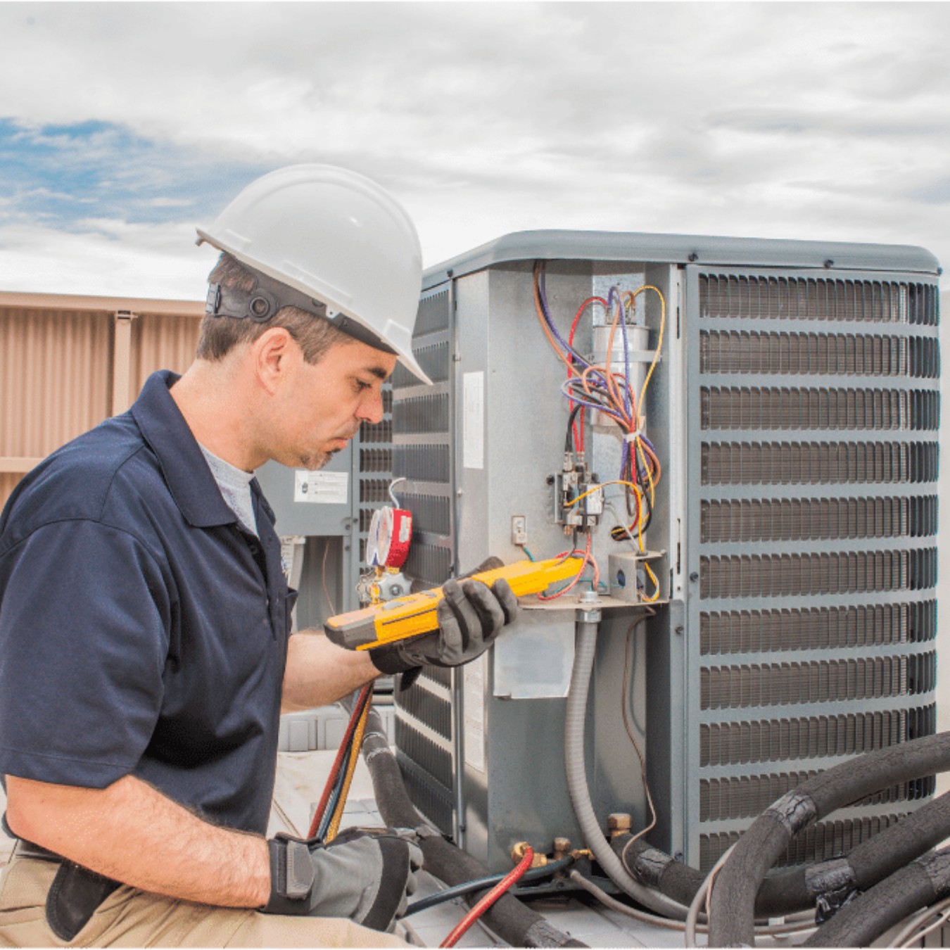 Guelph HVAC Pros HVAC technician servicing a system
