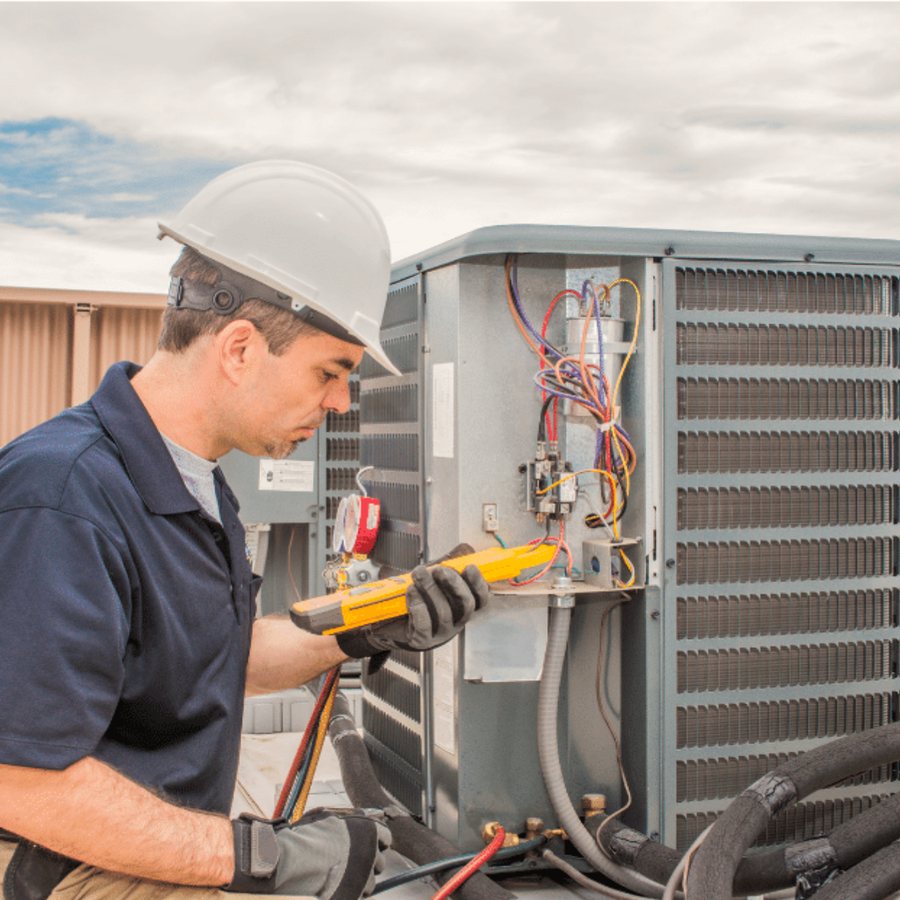 Guelph HVAC Pros HVAC technician servicing a system