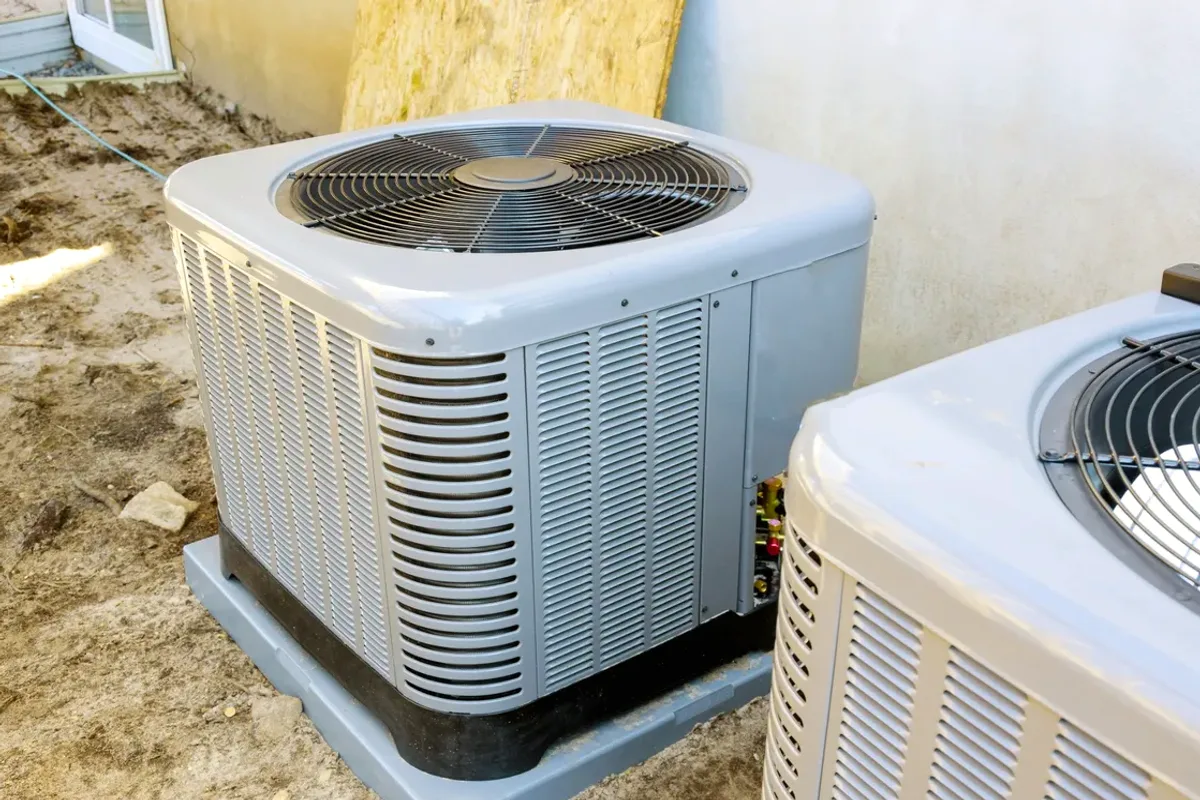 Two outdoor air conditioner condensers