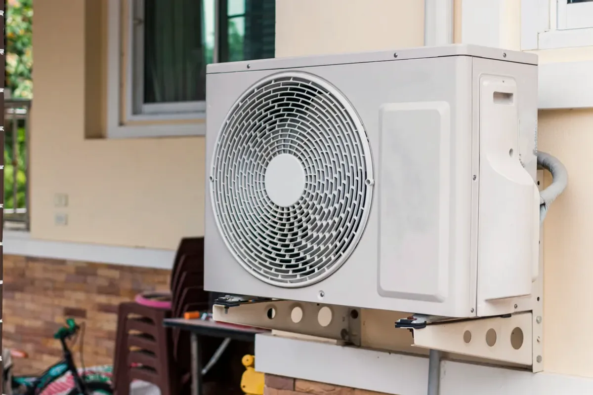 Outdoor heat pump unit on a wall bracket